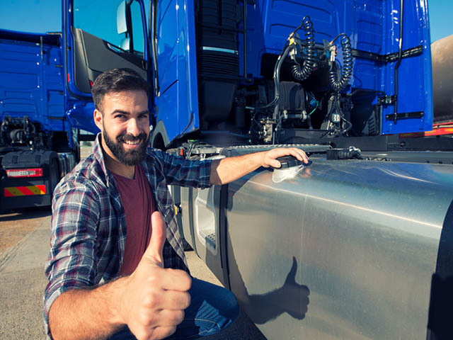 truck-driver-opening-reservoir-tank-refuel-truck-holding-thumbs-up.jpg